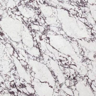 White marble surface with gray and dark veining patterns, creating a natural stone texture.
