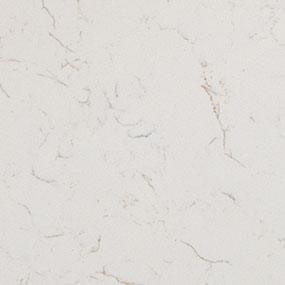 White marble surface with subtle, light gray veining and a smooth, polished texture.