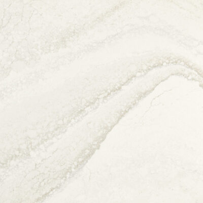 White marble surface with subtle grey veining and textured, wavy patterns running diagonally across the stone.