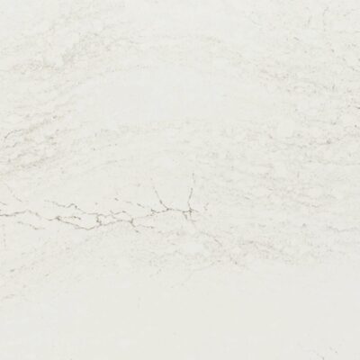 White marble surface with subtle grey veining and a slightly textured, natural stone appearance.