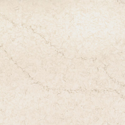 Light cream marble surface with subtle veining and textured, cloudy patterns throughout.