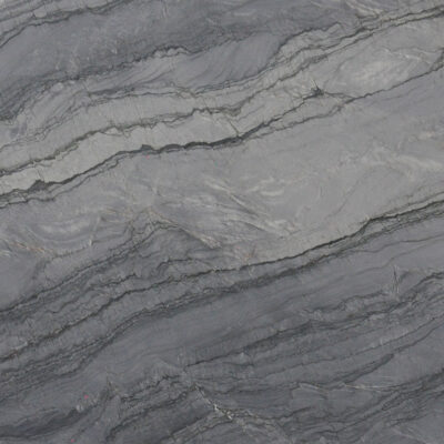 Gray stone surface with dark and light wavy, layered patterns resembling natural marble or slate.