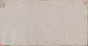 A blank, slightly wrinkled piece of beige paper, taped at the corners against a plain background.