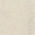 Corian Sheets Clam Shell CL Beige stone surface with small, scattered specks in light brown and gray tones.