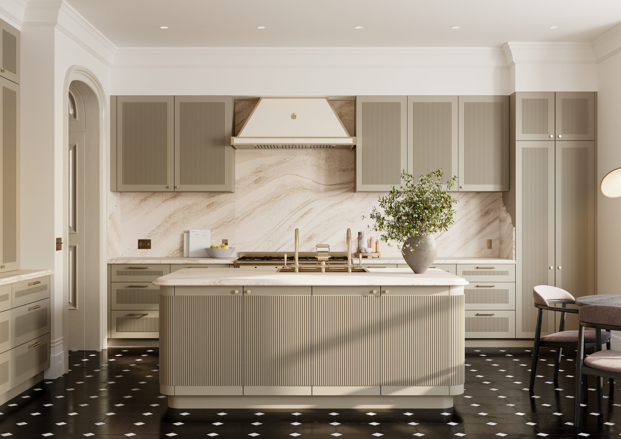 Modern kitchen with beige cabinets, marble backsplash, island with sink, and a vase with greenery on the island.
